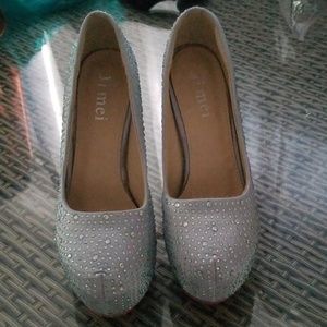 Red bottom heels. Not original.